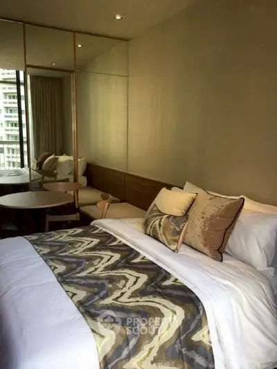 Luxurious bedroom with stylish decor and large window view