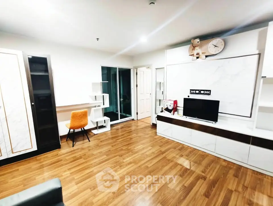 Spacious modern living room with wooden flooring and stylish furniture
