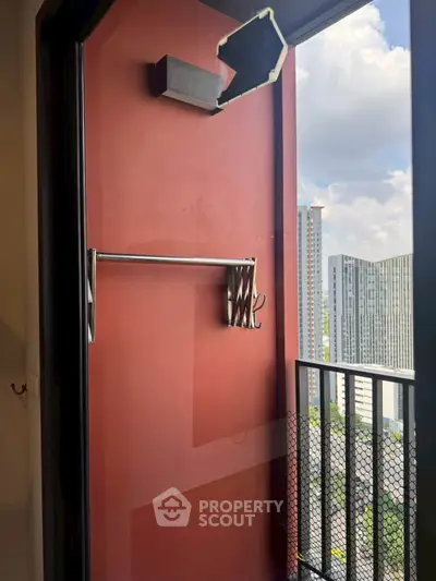 Modern balcony with city view in high-rise apartment