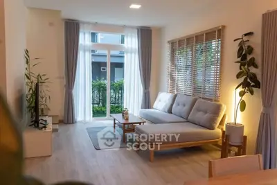Modern living room with large windows and stylish furniture