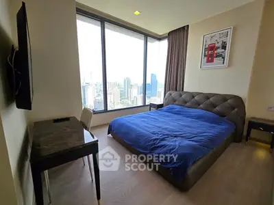 Luxurious bedroom with stunning city view and modern furnishings