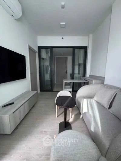 Modern living room with sleek furniture and natural light
