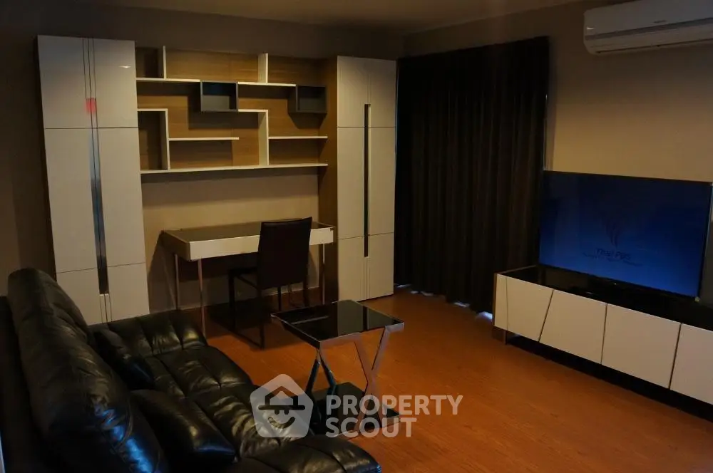 Modern living room with sleek furniture and stylish shelving unit