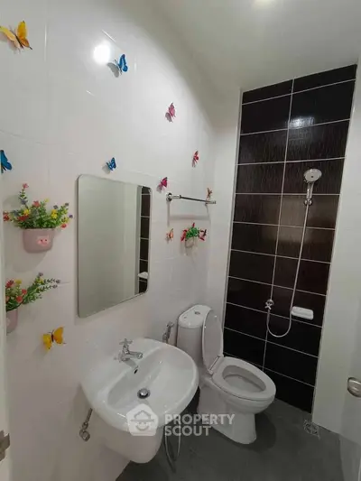 Charming bathroom with decorative butterflies and modern fixtures