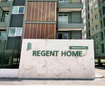 Modern apartment building exterior with Regent Home signage in Sukhumvit area.
