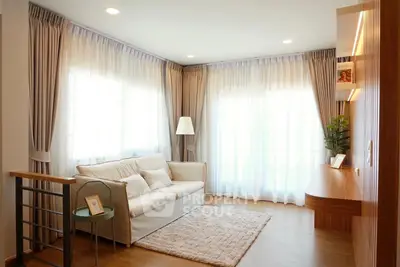 Bright and cozy living room with elegant curtains and modern decor