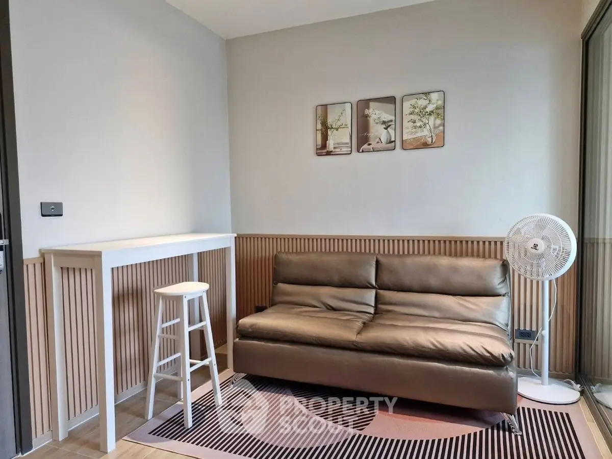 Modern living room with stylish sofa and decor, perfect for relaxation.