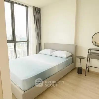 Modern bedroom with large window and minimalist decor in high-rise apartment.