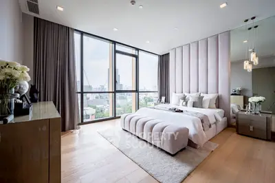 Luxurious bedroom with panoramic city view and elegant decor