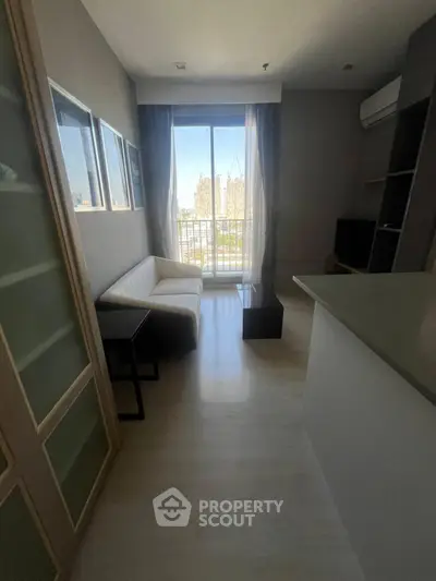 Modern living room with balcony view and sleek interior design