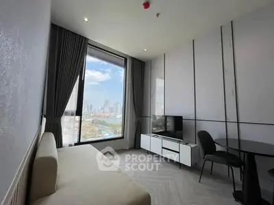 Modern living room with city view, sleek furniture, and large window.