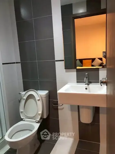 Modern bathroom with sleek design and contemporary fixtures in a stylish apartment.