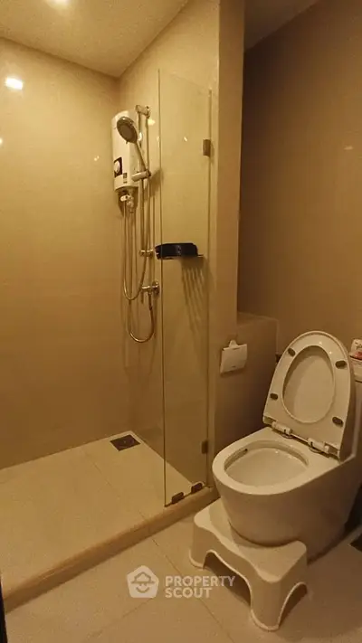 Modern bathroom with glass shower and toilet in sleek design