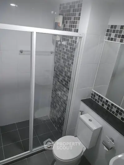 Modern bathroom with sleek shower enclosure and stylish tile design