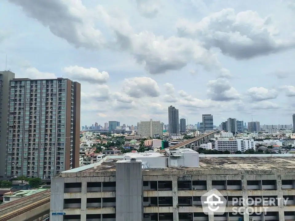 Stunning cityscape view from high-rise building showcasing urban skyline and architectural diversity.