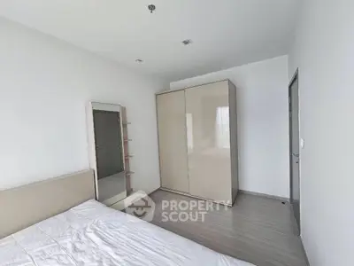 Spacious bedroom with modern wardrobe and minimalist decor