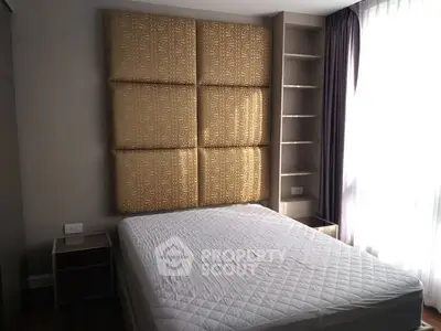 Modern bedroom with stylish headboard and natural light