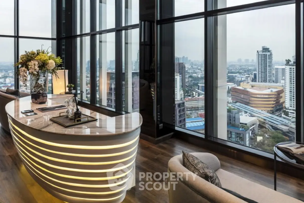 Luxurious high-rise living room with panoramic city views and modern decor.