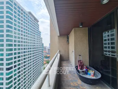 Spacious balcony with city view in modern high-rise building