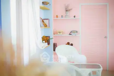 Charming pastel-themed living room with vintage decor and cozy seating.