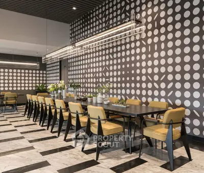 Stylish modern dining area with long table and patterned walls