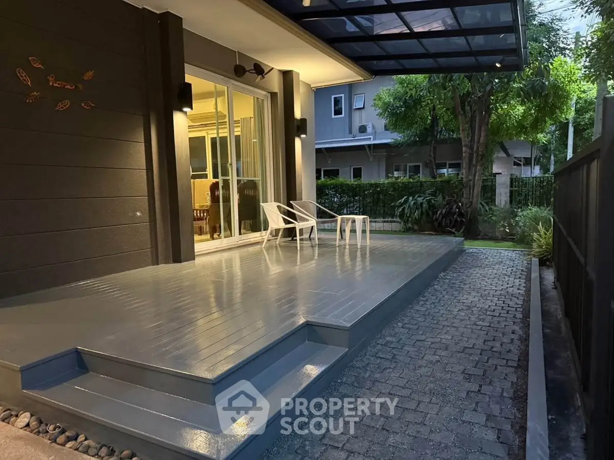 Charming outdoor patio with modern design and cozy seating area, perfect for relaxation and entertaining.