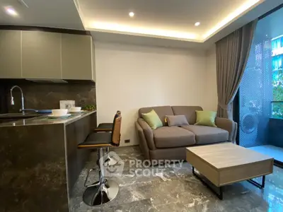 Modern living room with open kitchen and stylish decor in a cozy apartment