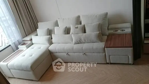 Stylish modern living room with elegant sectional sofa and natural light