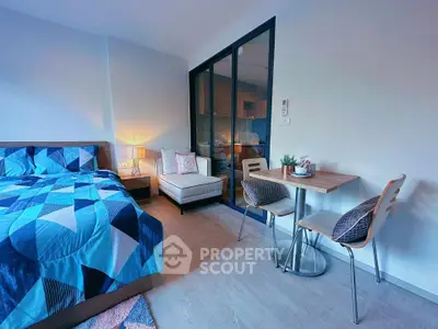 Modern studio apartment with cozy bedroom and dining area