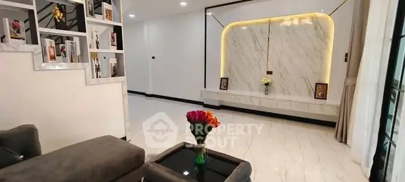 Luxurious modern living room with elegant marble accents and stylish decor