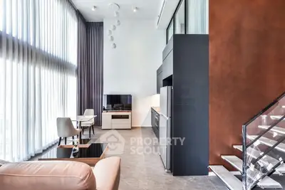 Luxurious modern living room with high ceilings and elegant decor