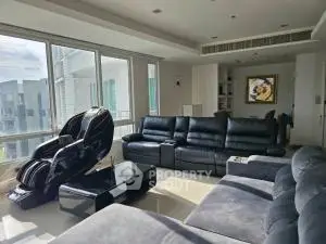 Spacious modern living room with large windows and luxurious seating