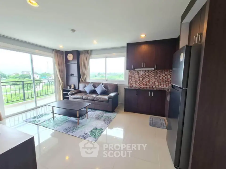 Spacious living room with modern decor and scenic view, perfect for relaxation.