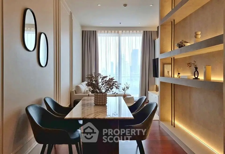 Elegant dining area with modern decor and city view, featuring stylish chairs and a marble table.