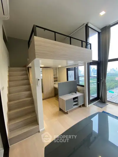 Modern loft apartment with mezzanine and stunning city view, featuring sleek design and ample natural light.