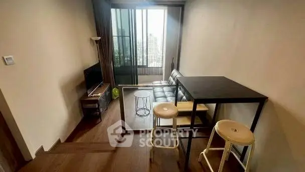 Modern compact living room with city view and stylish furniture