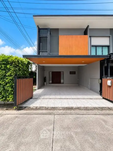 Modern two-story house with stylish facade and spacious driveway