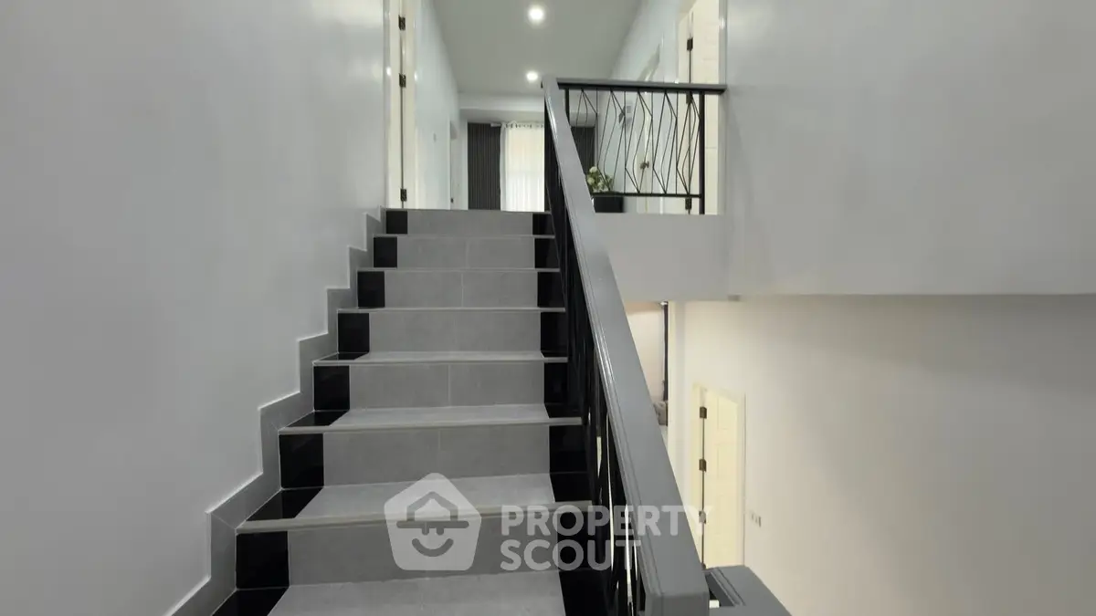 Modern staircase with sleek railing in a contemporary building interior