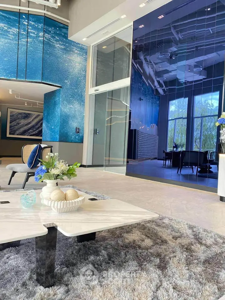 Luxurious modern living room with elegant decor and large windows