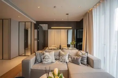 Luxurious modern living room with elegant decor and ample natural light