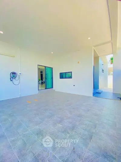 Spacious modern garage with sleek design and ample lighting, perfect for secure parking and storage.