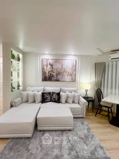 Luxurious living room with elegant sofa, stylish decor, and ambient lighting for a cozy atmosphere.