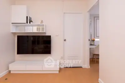 Modern living room with sleek TV unit and minimalist decor