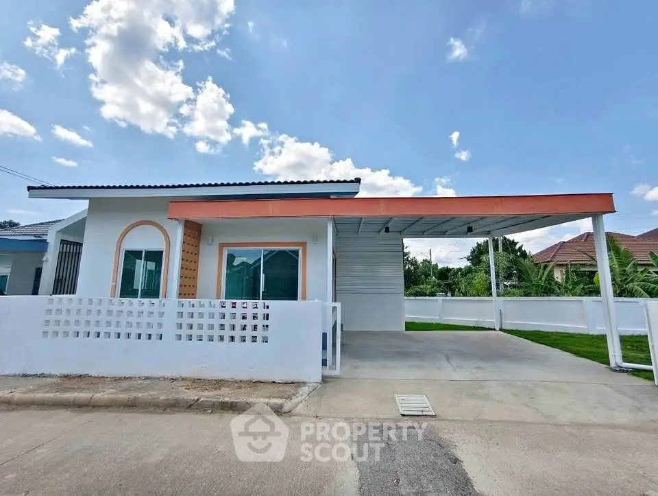 Charming single-story house with carport and modern facade in a serene neighborhood.