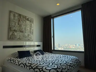 Modern bedroom with stunning city view and stylish decor