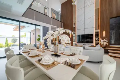 Luxurious modern living room with elegant dining area and high ceilings, featuring stylish decor and ample natural light.