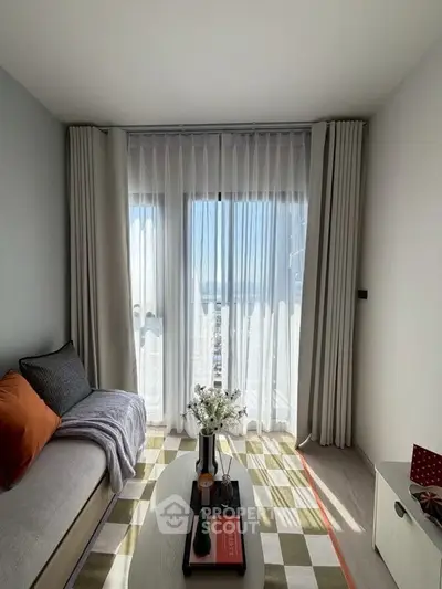Bright living room with floor-to-ceiling windows and modern decor