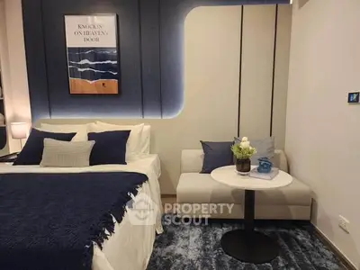 Stylish bedroom with modern decor and cozy seating area