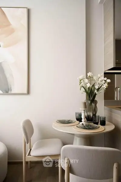 Stylish dining nook with elegant decor and modern furniture in a cozy apartment setting.