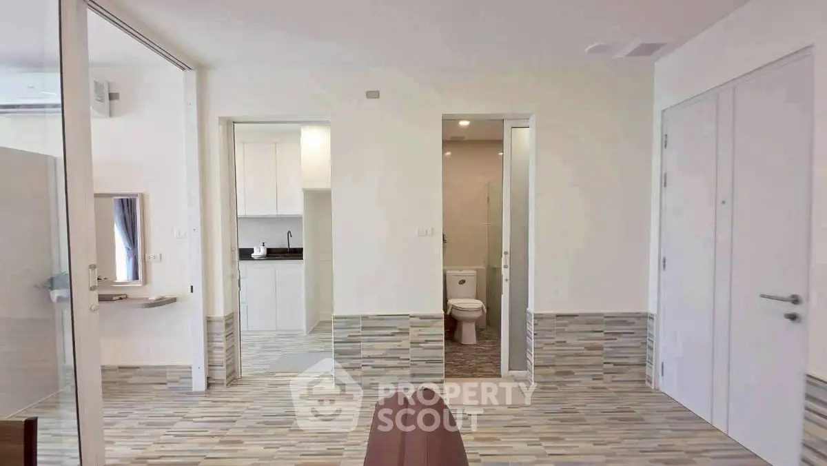 Modern apartment interior with open layout and stylish flooring